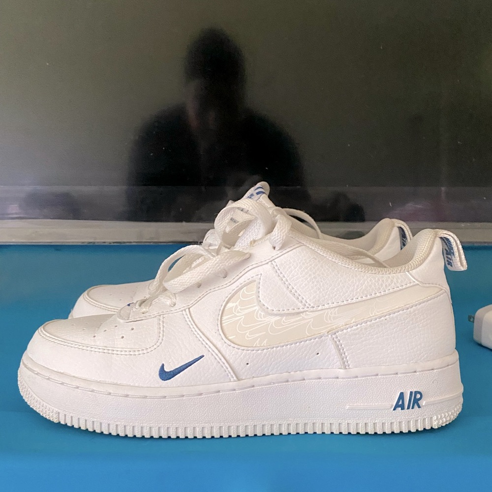 White Air Force 1s with small blue check holographic nike check